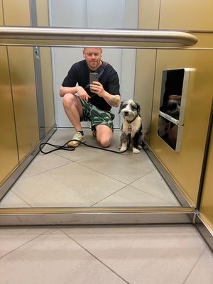 A photo of me and my dog Tofu in a elevator mirror